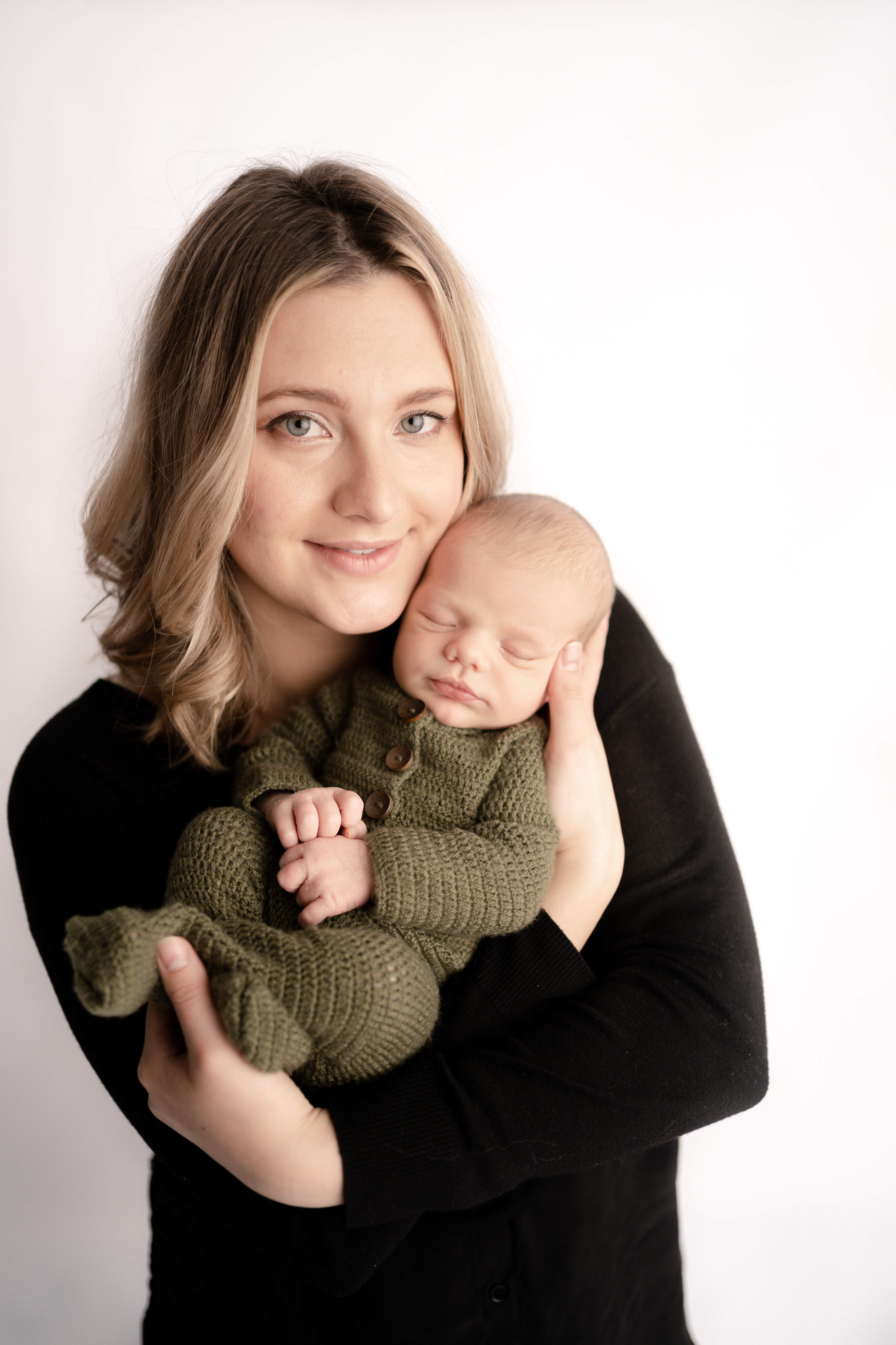 Embracing Motherhood. Mom holding a newborn